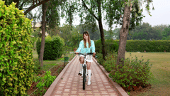 Woman  bicycling in a park