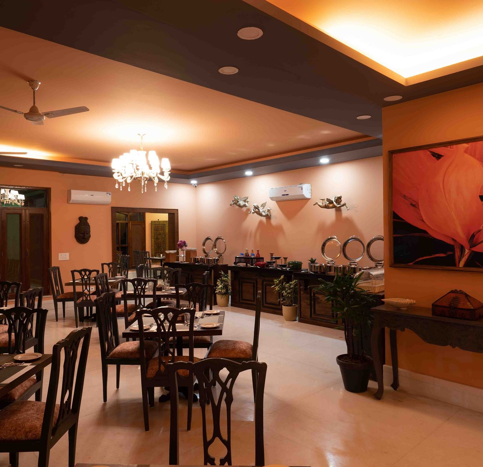An image of  modern restaurant interior of Atman, dharamshala with stylish furniture and artwork.