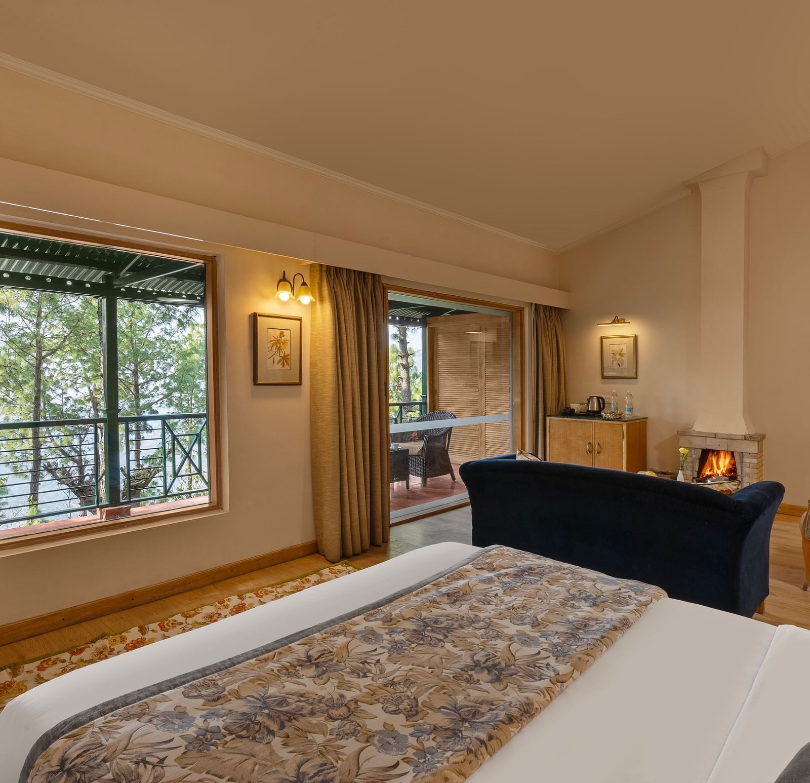 Premium Cottage with plushy bed a fire place and sofa along with TV at Baikuth resort, kasauli.