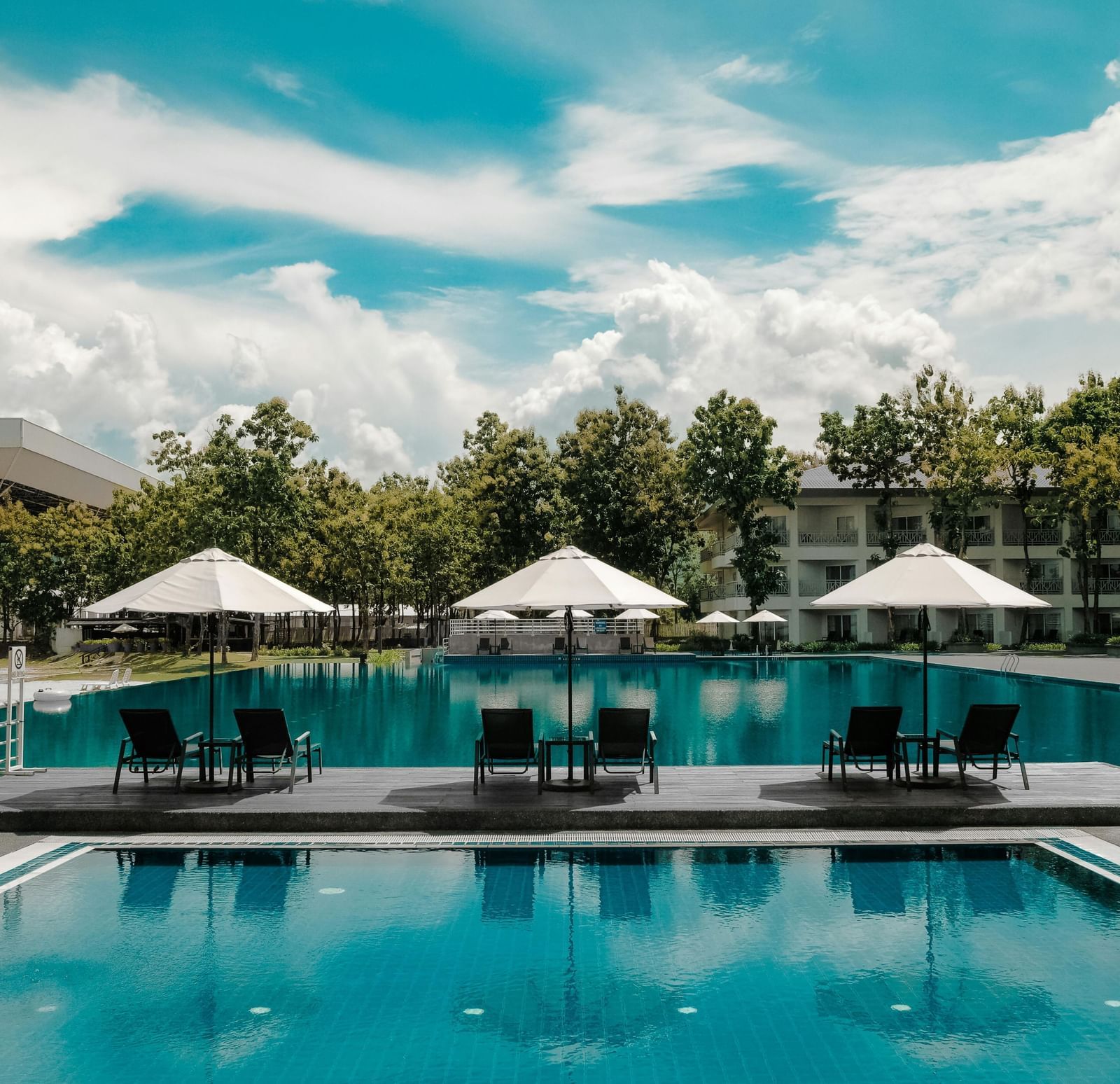 An image of a poolside in a villa | Ocean Sprays