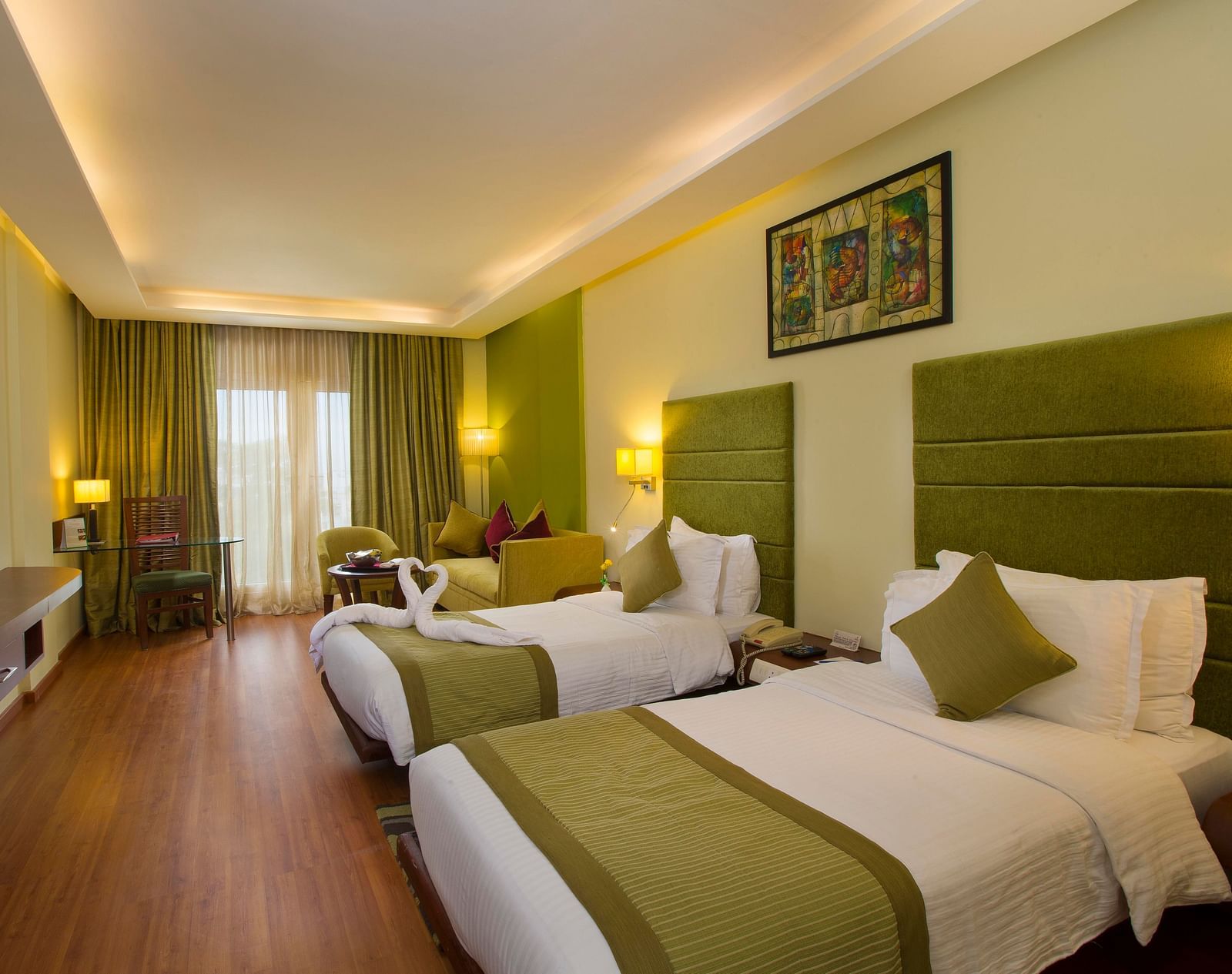 twin beds placed in Superior Room at Hotel Atithi - TGI Grand, Pondicherry
