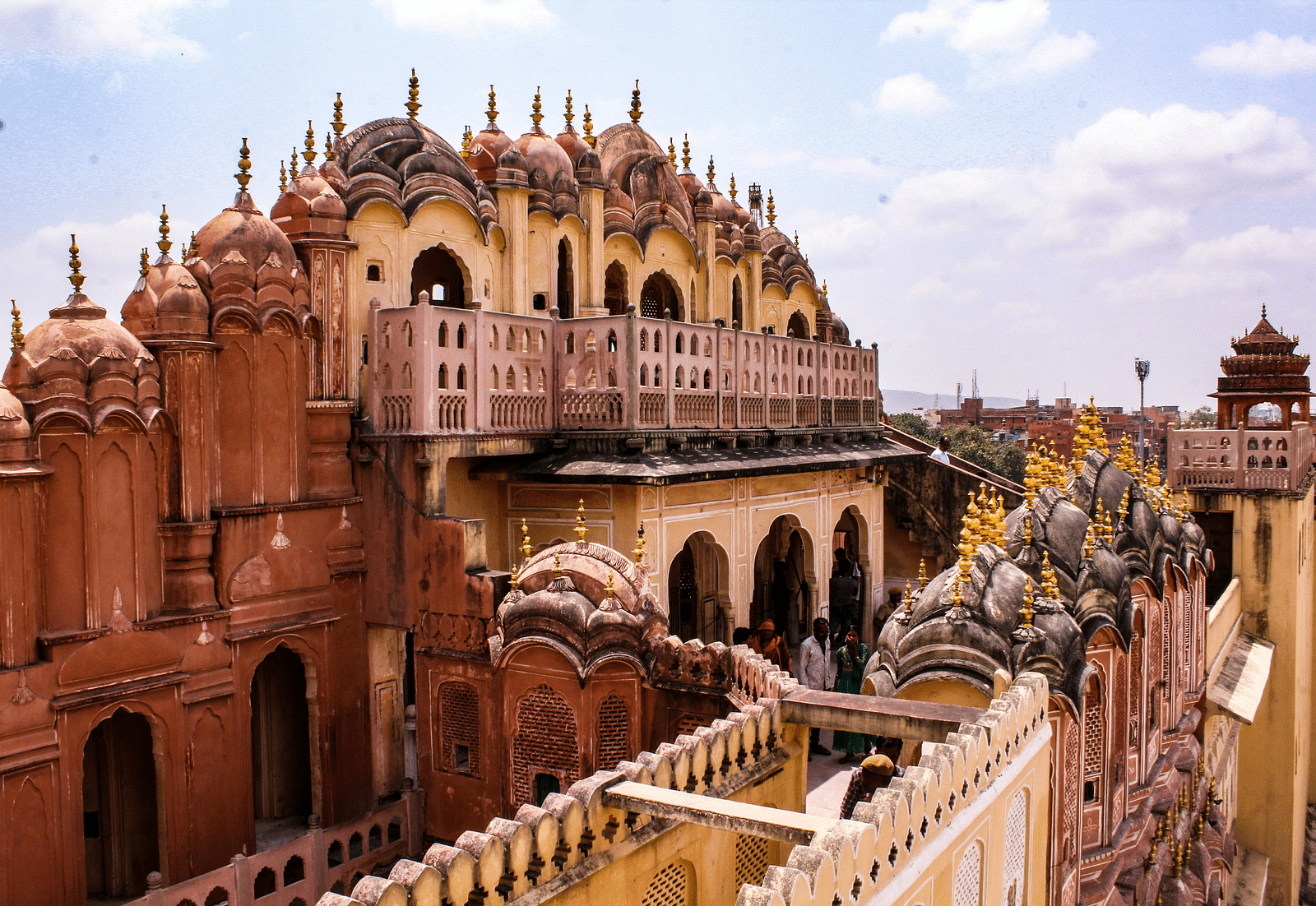 image of a palace from an upper level highlighting the pathways and the brown coloured walls of the palace