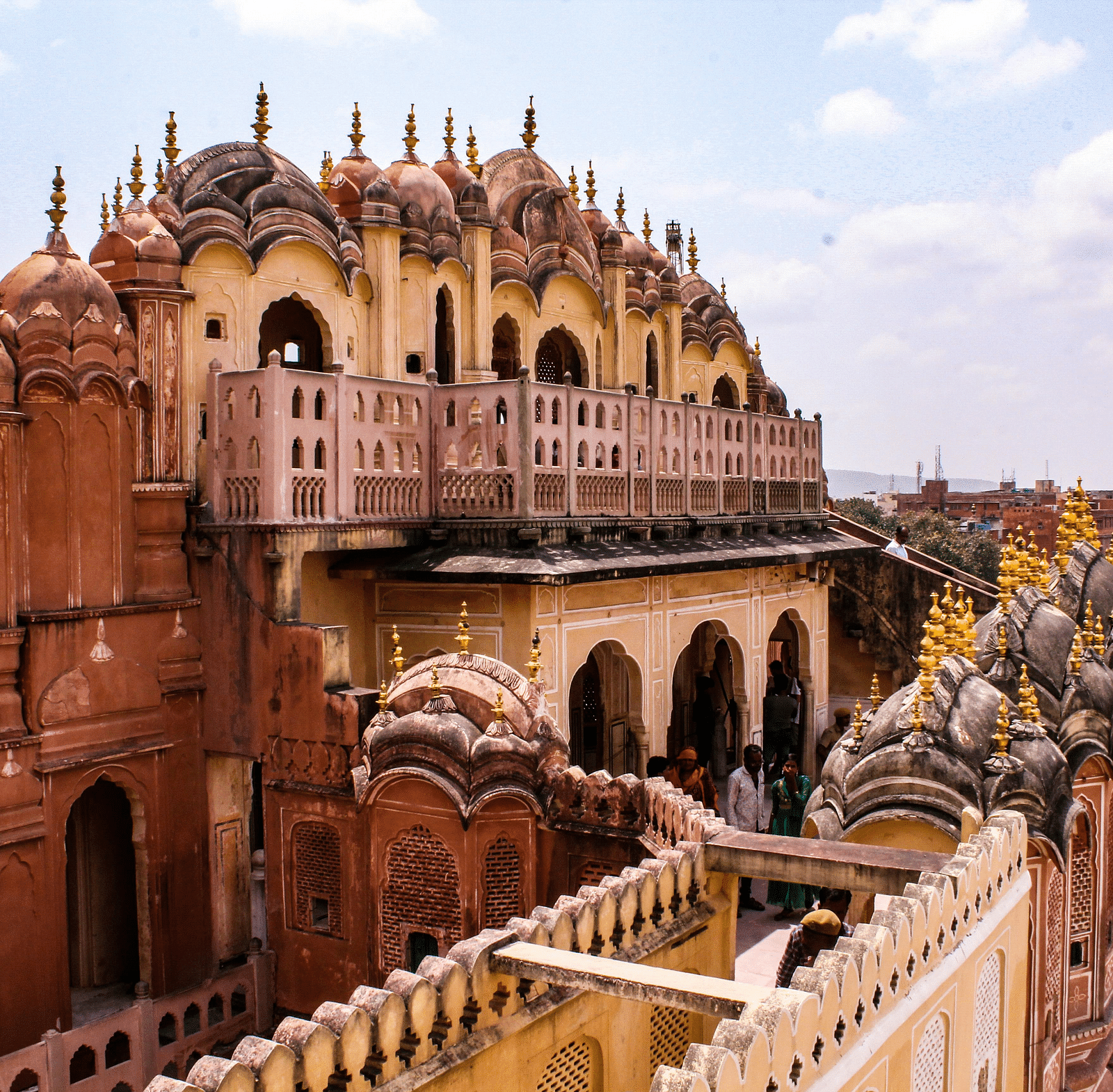 image of a palace from an upper level highlighting the pathways and the brown coloured walls of the palace