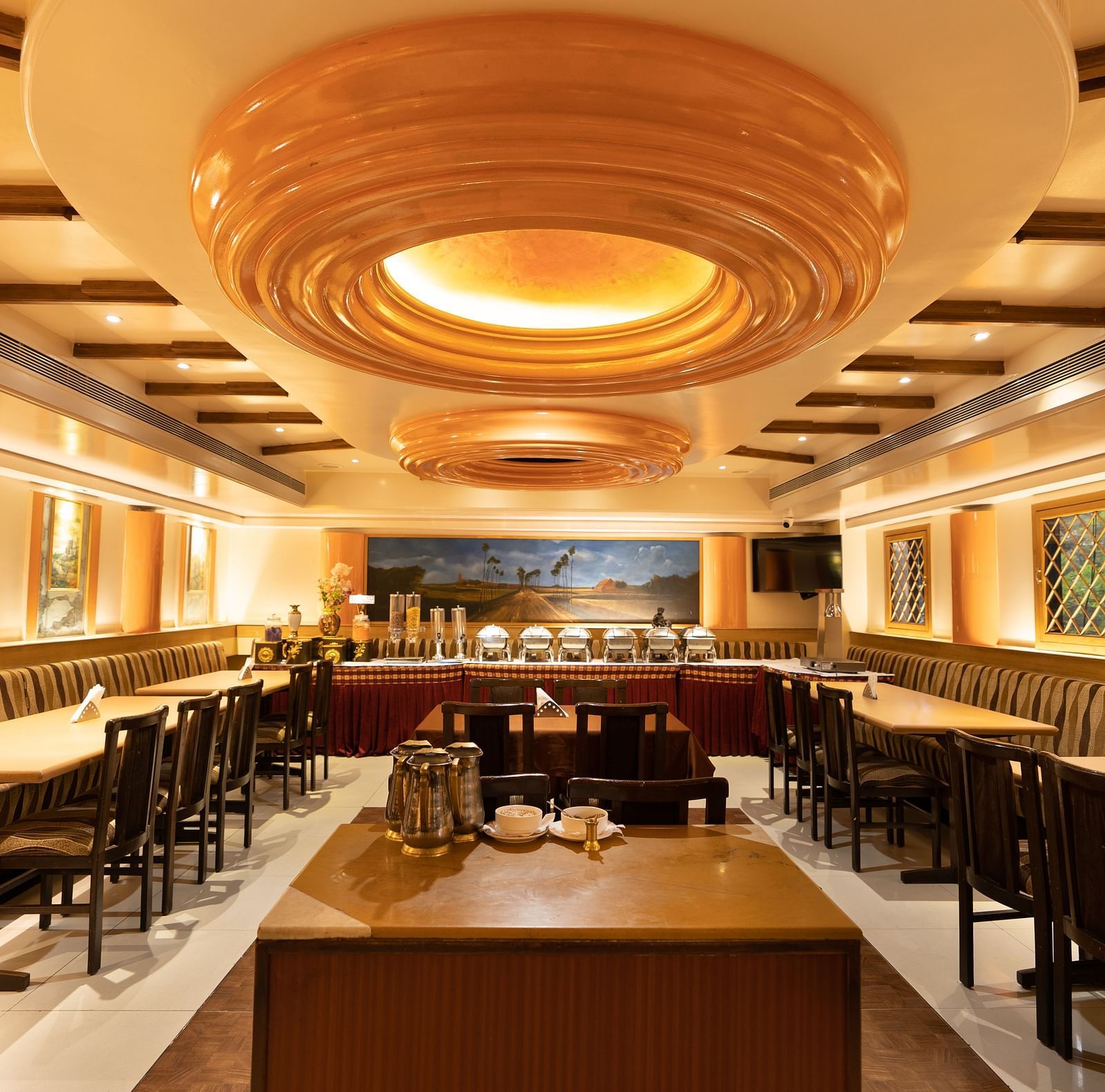 Seating arrangement in a restaurant at Hotel Pai Viceroy, Jayanagar