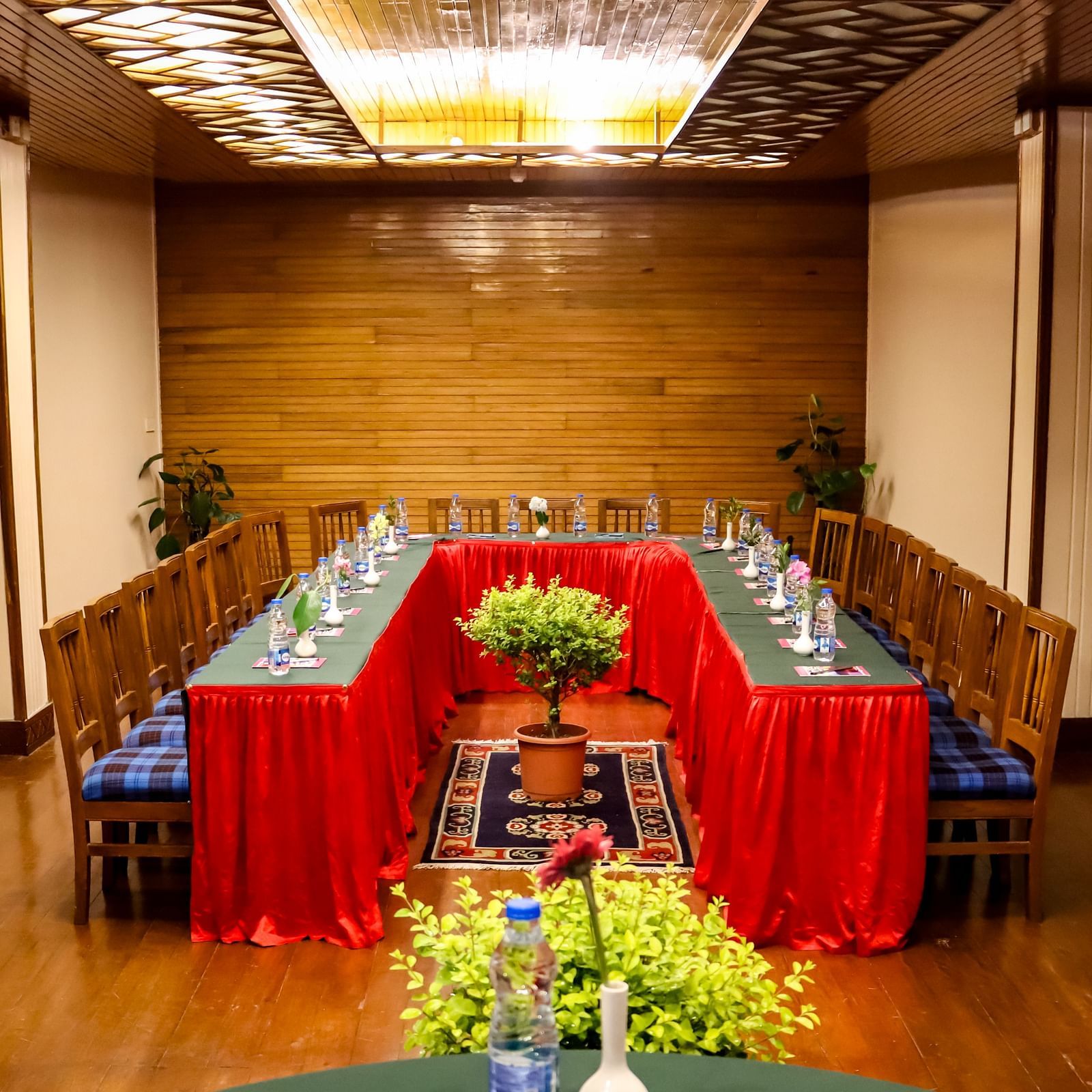 U-shaped conference arrangement in a well-lit meeting hall, perfect for workshops and corporate sessions - cedar inn
