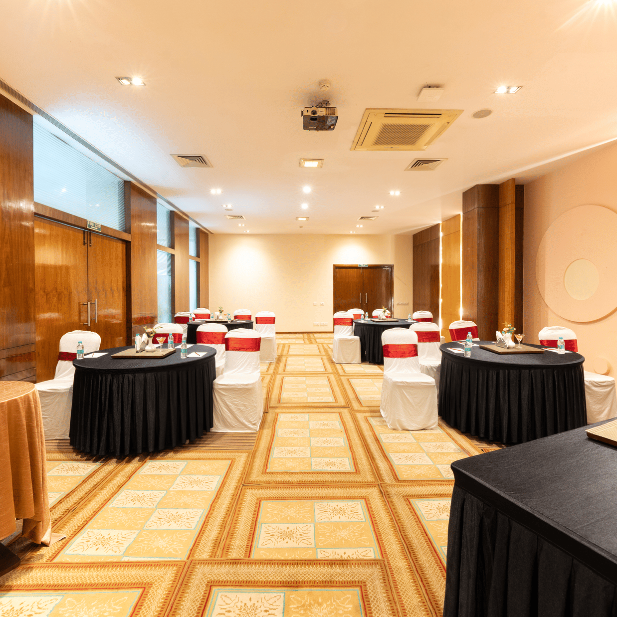 A hall with several decorated tables and a checkered floor. |  MGM Mark Whitefield