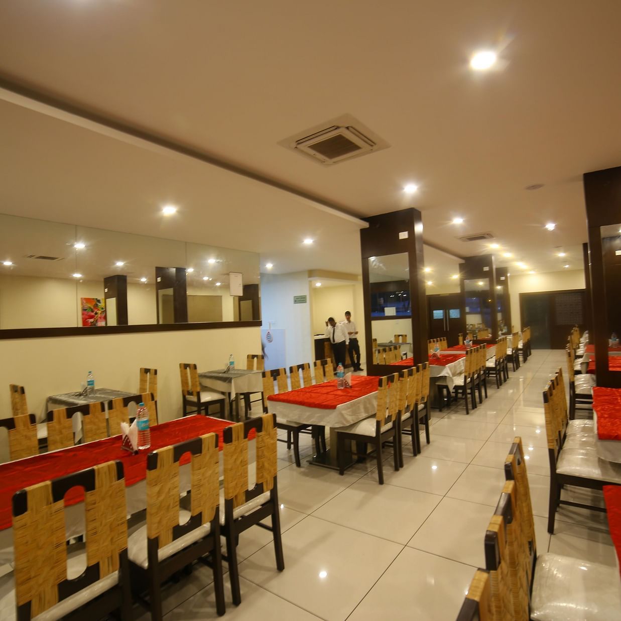 A restaurant consisting of a bunch of chairs and tables - Mysore Gate Hotel Bangalore