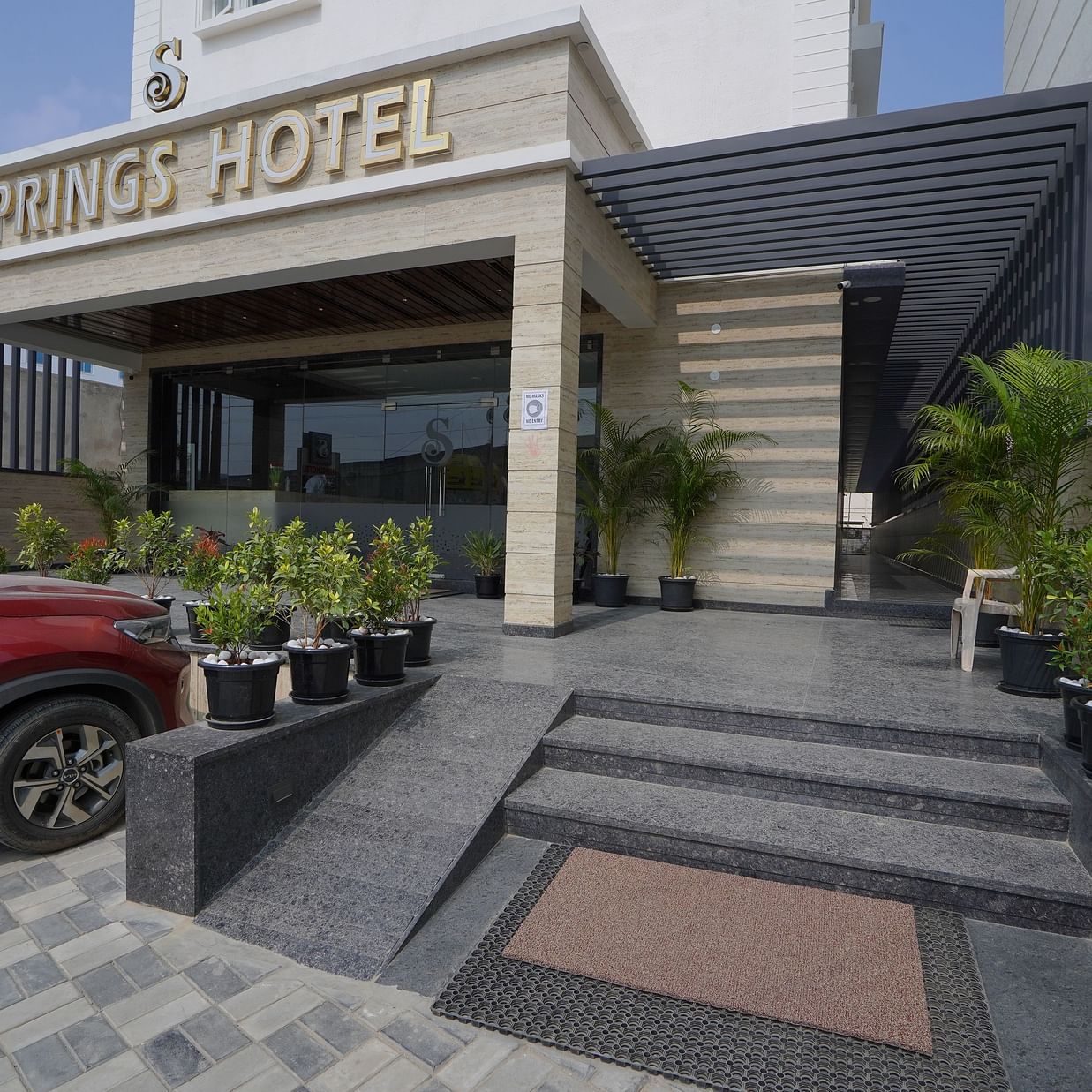 Facade with steps leading to the entrance - Springs Hotel Tirupati