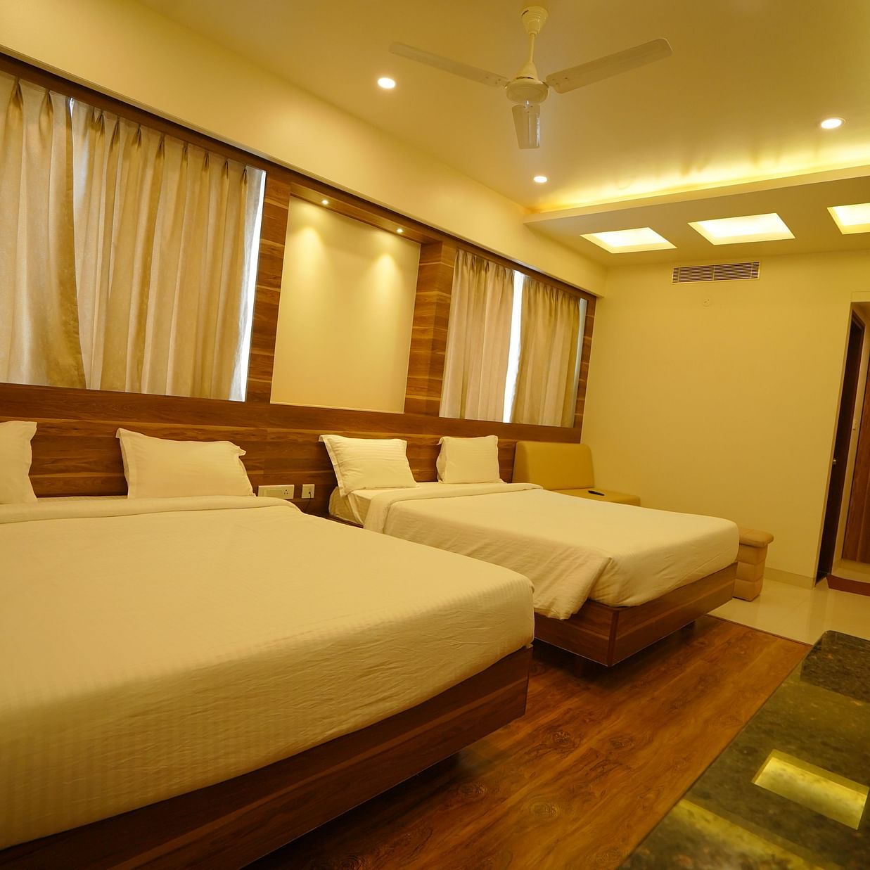 two double beds inside the premium family room - Springs Hotel Tirupati