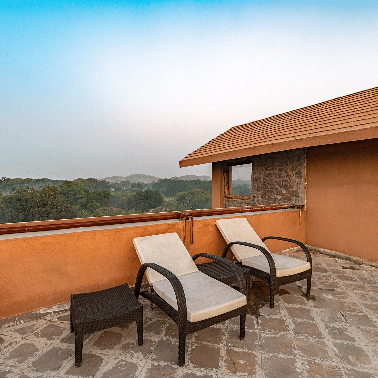 two seats kept on a terrace of one of the rooms in Ranthambore