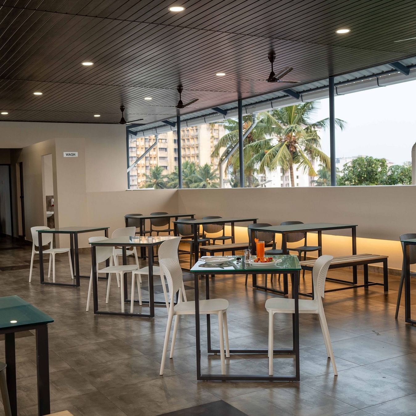 Our restaurant with comfortable chairs and tables - Court 11, Kochi