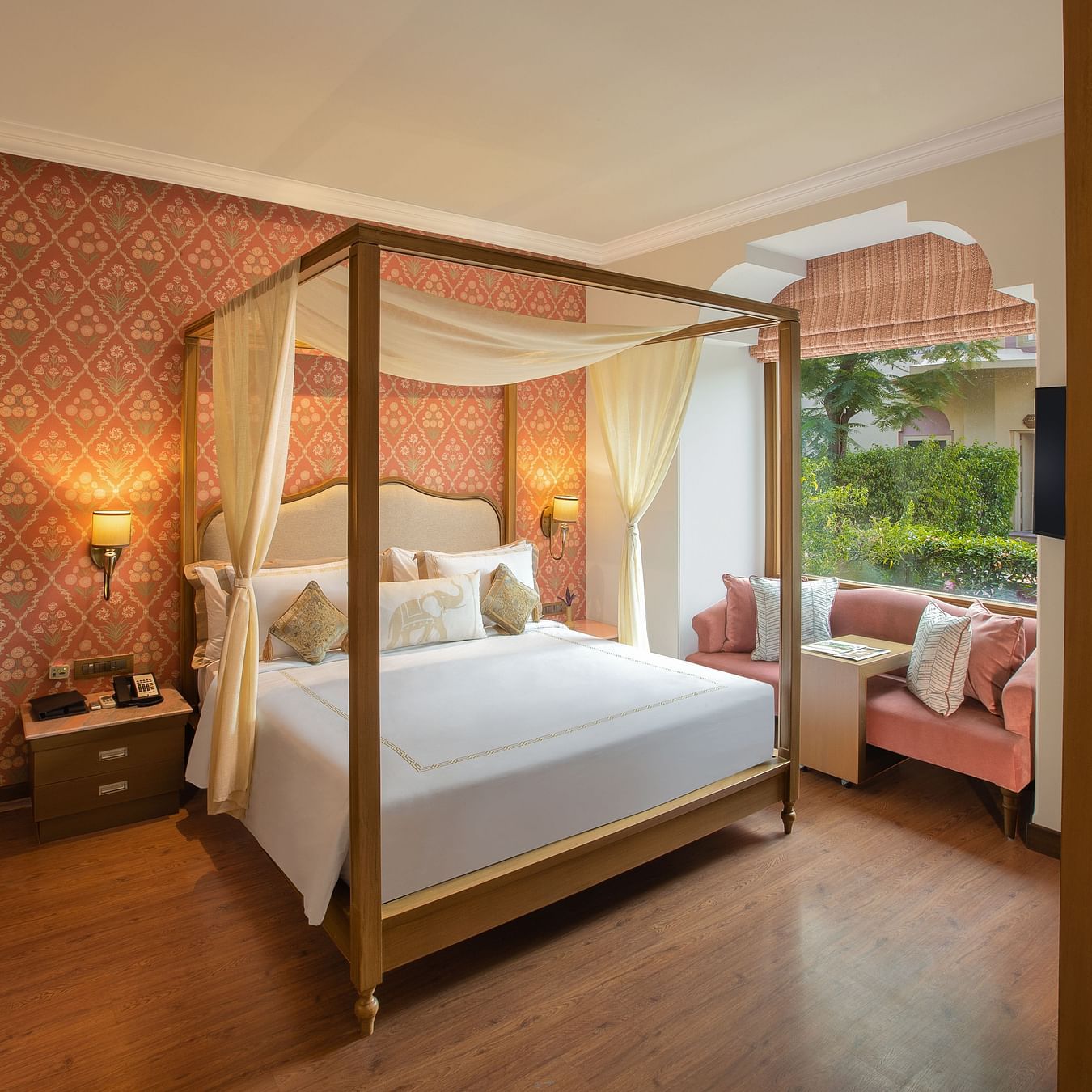 luxurious room with a commodious king size bed and cushy sofa designed with plush interiors