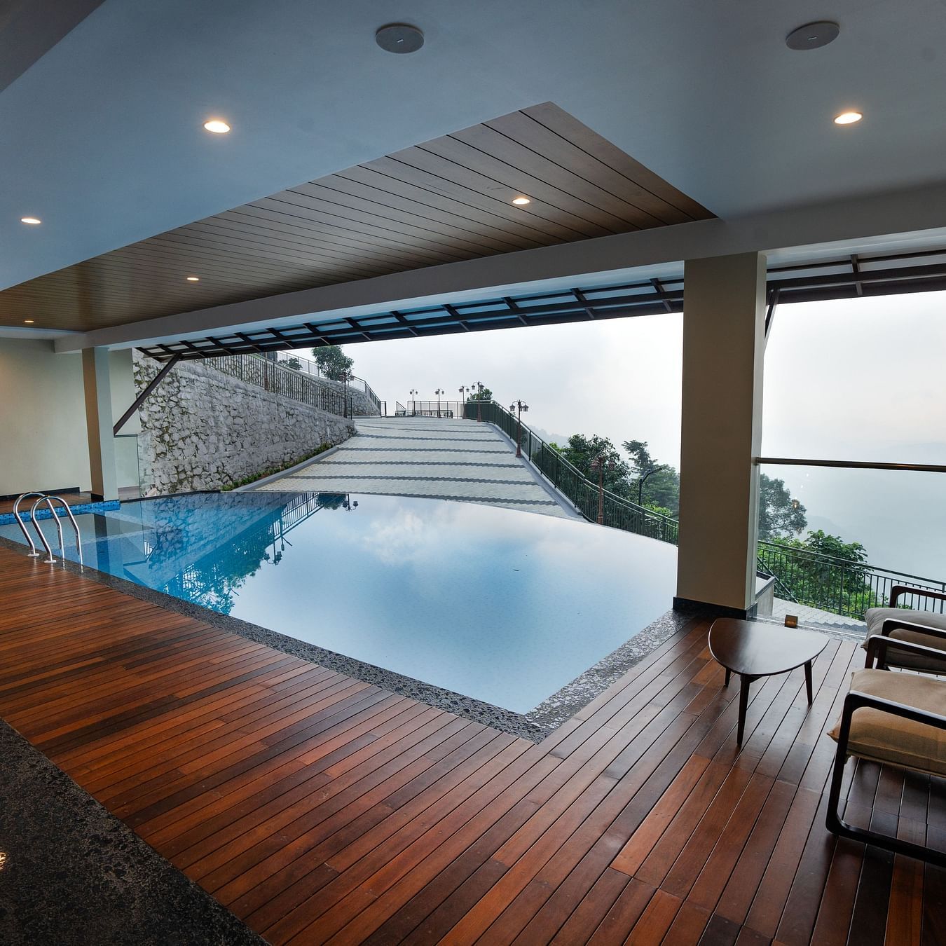 An outdoor swimming pool | Misty Queen by Dimora, Kakkadampoyil