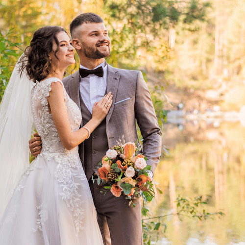 a couple smiling for a wedding shoot