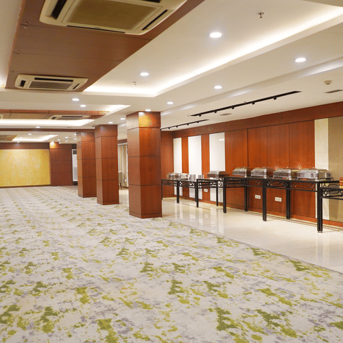 The versatile conference room at Nemesia offers a flexible layout, suitable for various meeting configurations, with a buffet attached.