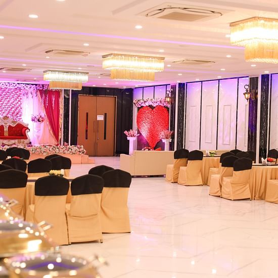Chairs and a stage at Magnolia A Banquet at Fiori Hotel