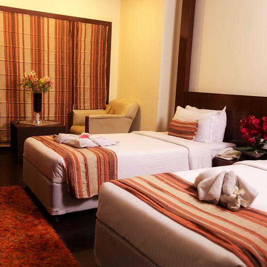 twin beds offered at one of the rooms - Hotel Polo Towers, Shillong