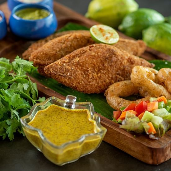 a plate of fish finger with onion rings - polo floatel kolkata