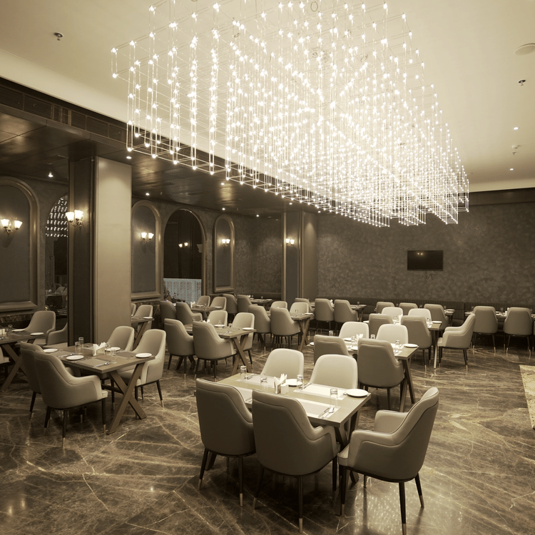 restaurant with tables and chairs at Classic Sapphire by Ananta 2