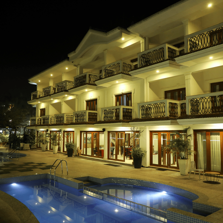 interior view of rooms with swimming pool in the night of White pearl suites by rosetum 