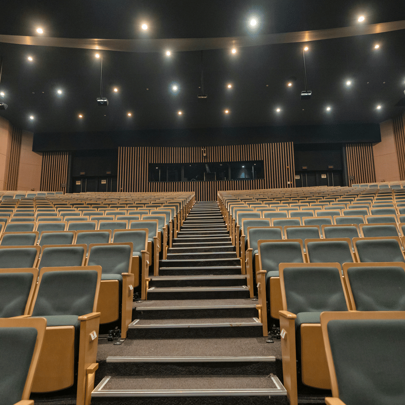 A view from below of the empty seating inside an event space at Doha Exhibition & Convention Center (DECC).