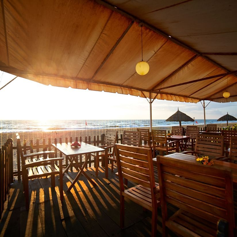 The outdoor seating arrangement at Sea Crest with views of the sea