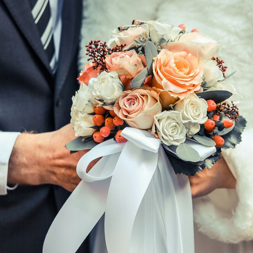 Couples holding flowers with love