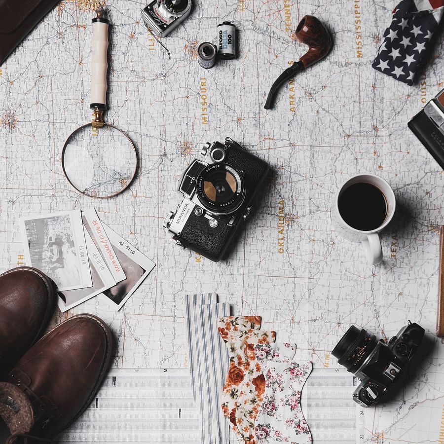 a desk full of travelling equipments
