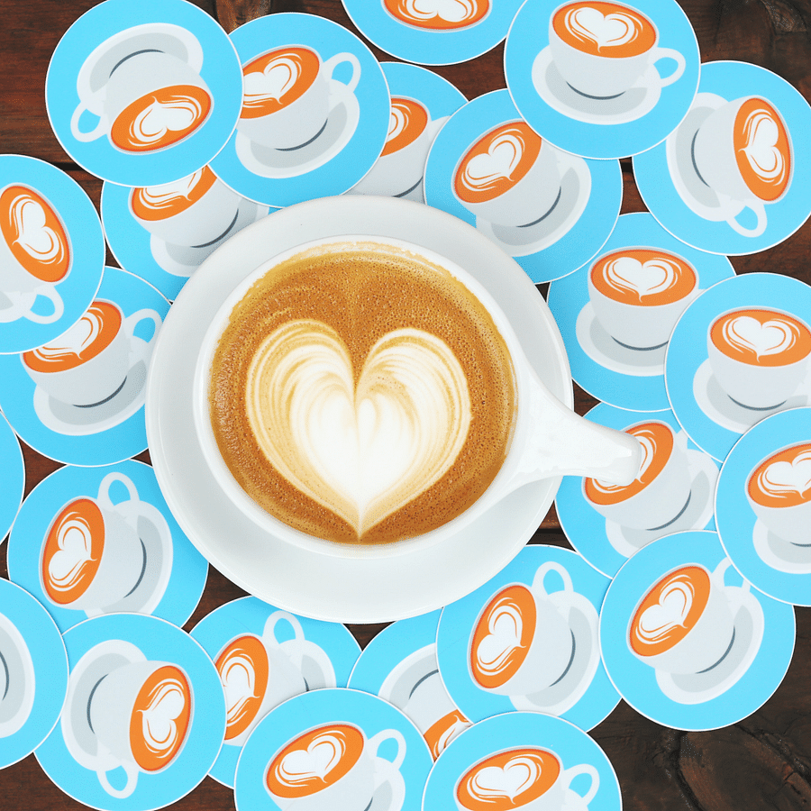 A coffee cup with heart-shaped foam surrounded by smaller cup icons.