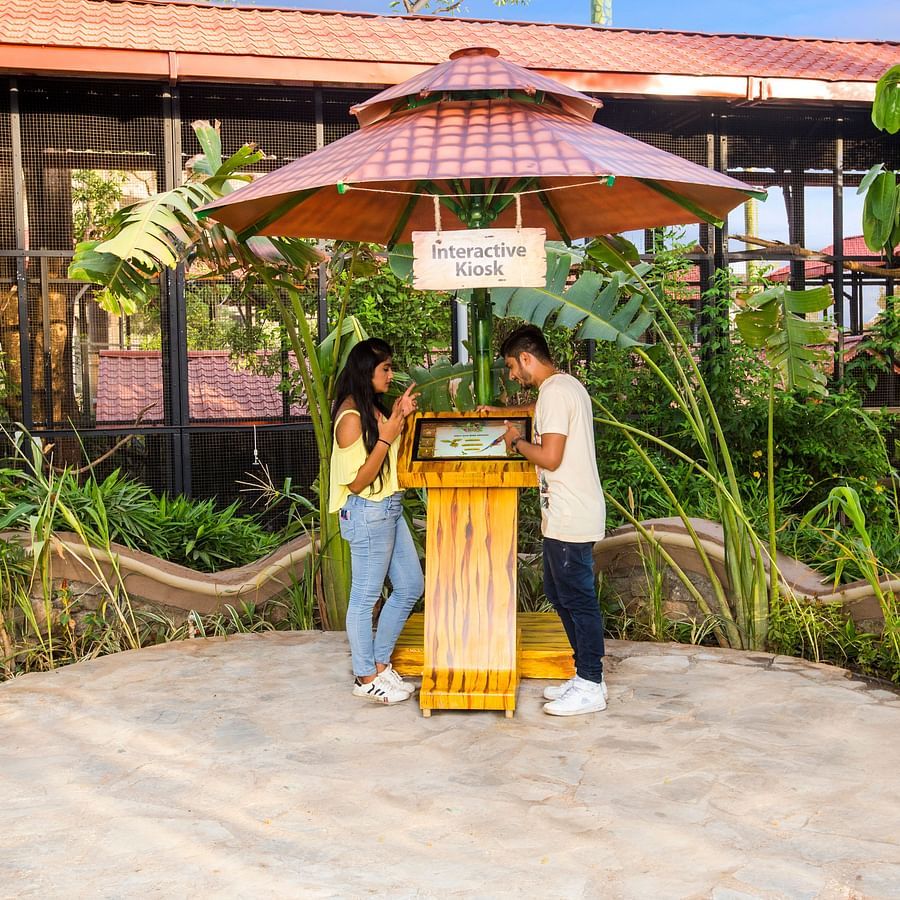 bird park esselworld,  a couple interacting with a kiosk