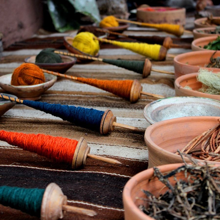 textile threads in many colours kept on a table