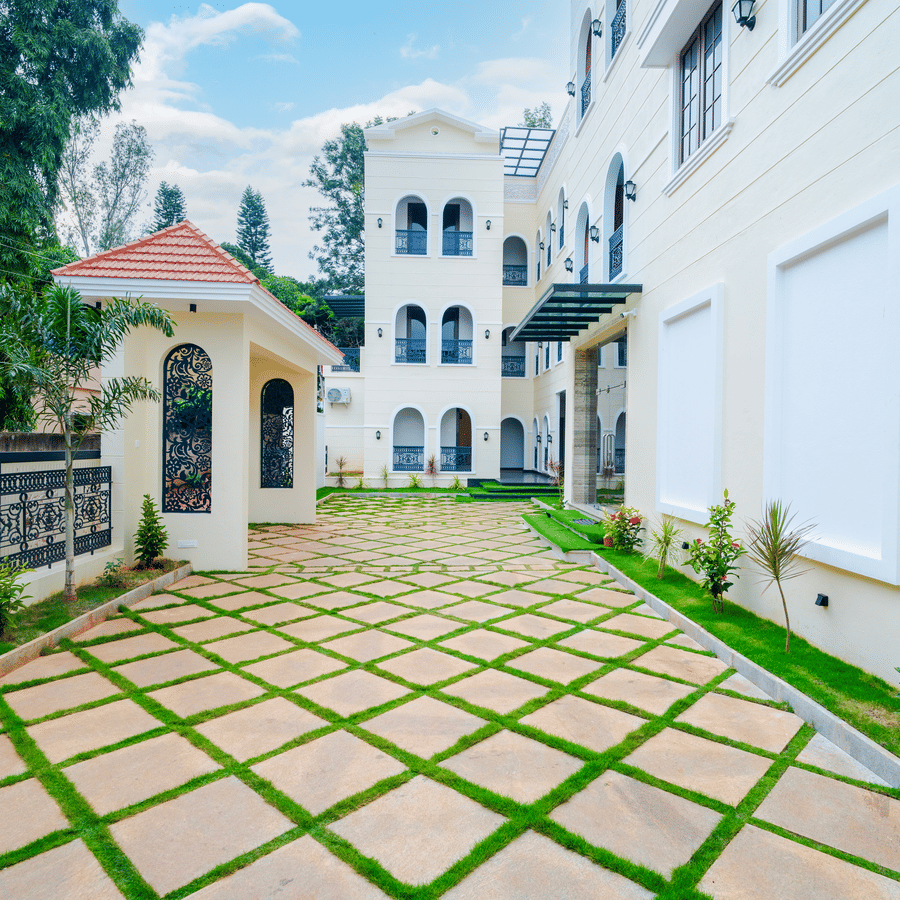 An outdoor space with checkered floor, buildings, and trees at MGM Hotels & Resorts.