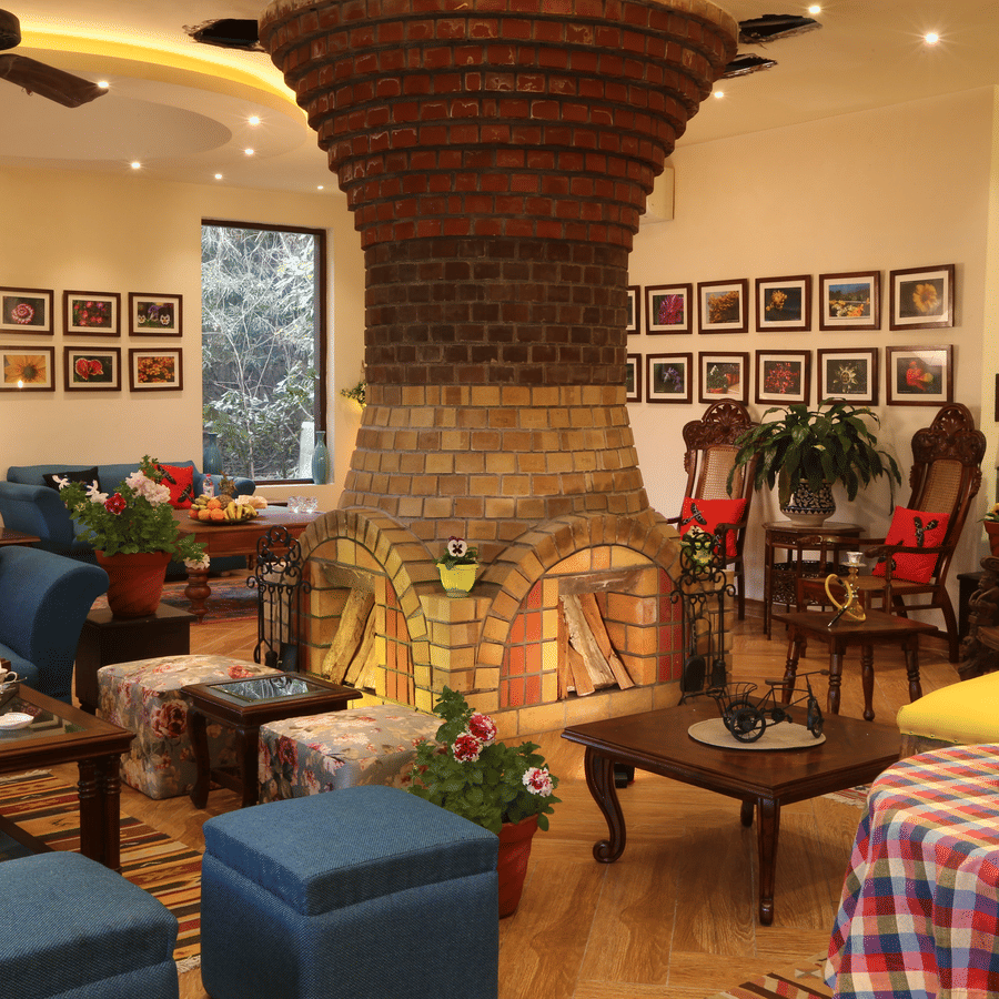  A living room with a fireplace and comfortable seating.