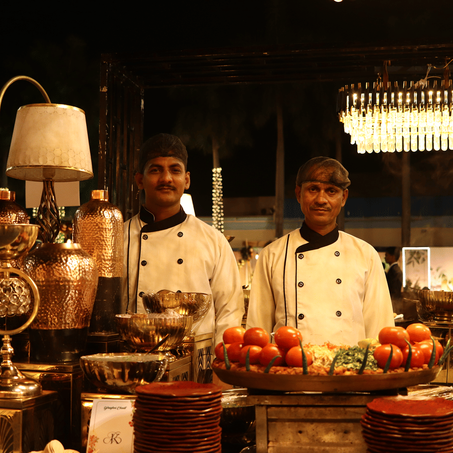Chefs at a live buffet counter preparing gourmet dishes during an evening event at The Sonnet.