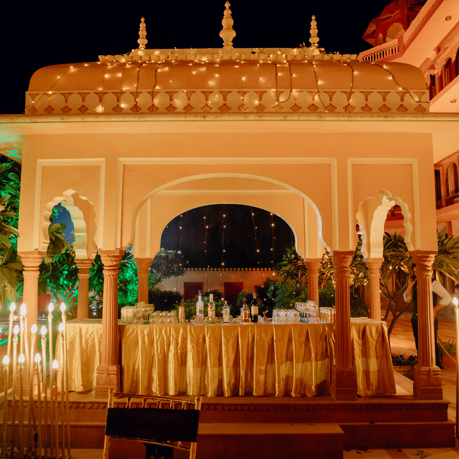 Beautifully lit palace entrance with elegant decor for a grand wedding celebration.