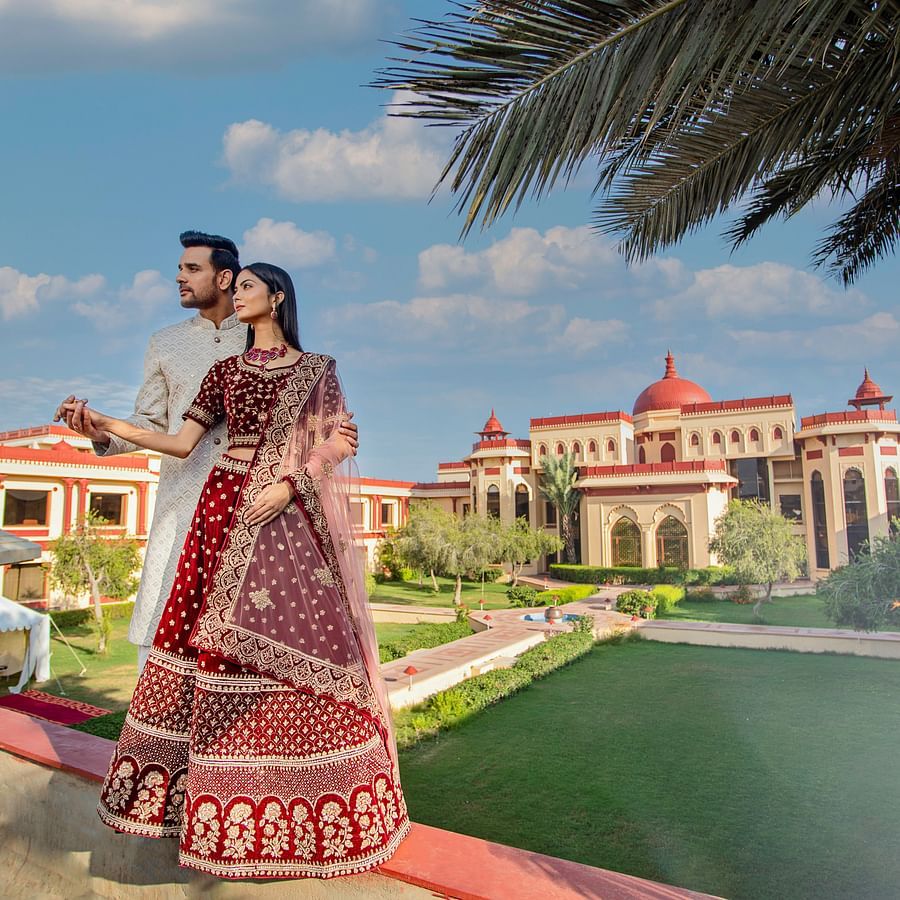 Ummed Hotels - The bride and groom and our hotel in the backdrop