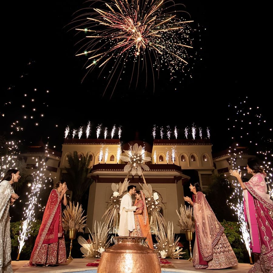 Ummed Hotels - Wedding celebrations with people standing around the bride groom