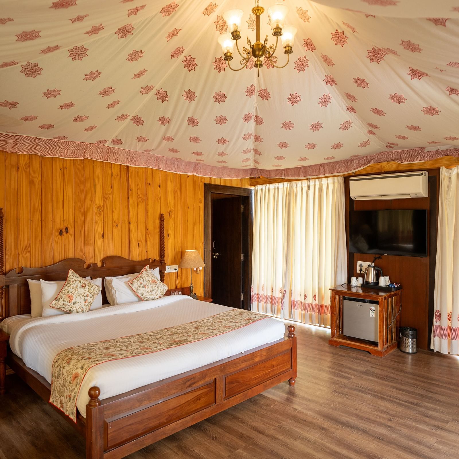 Image of tent room with with room with chandelier hanging from the ceiling at  Aanandam Resort & Spa, Pushkar.