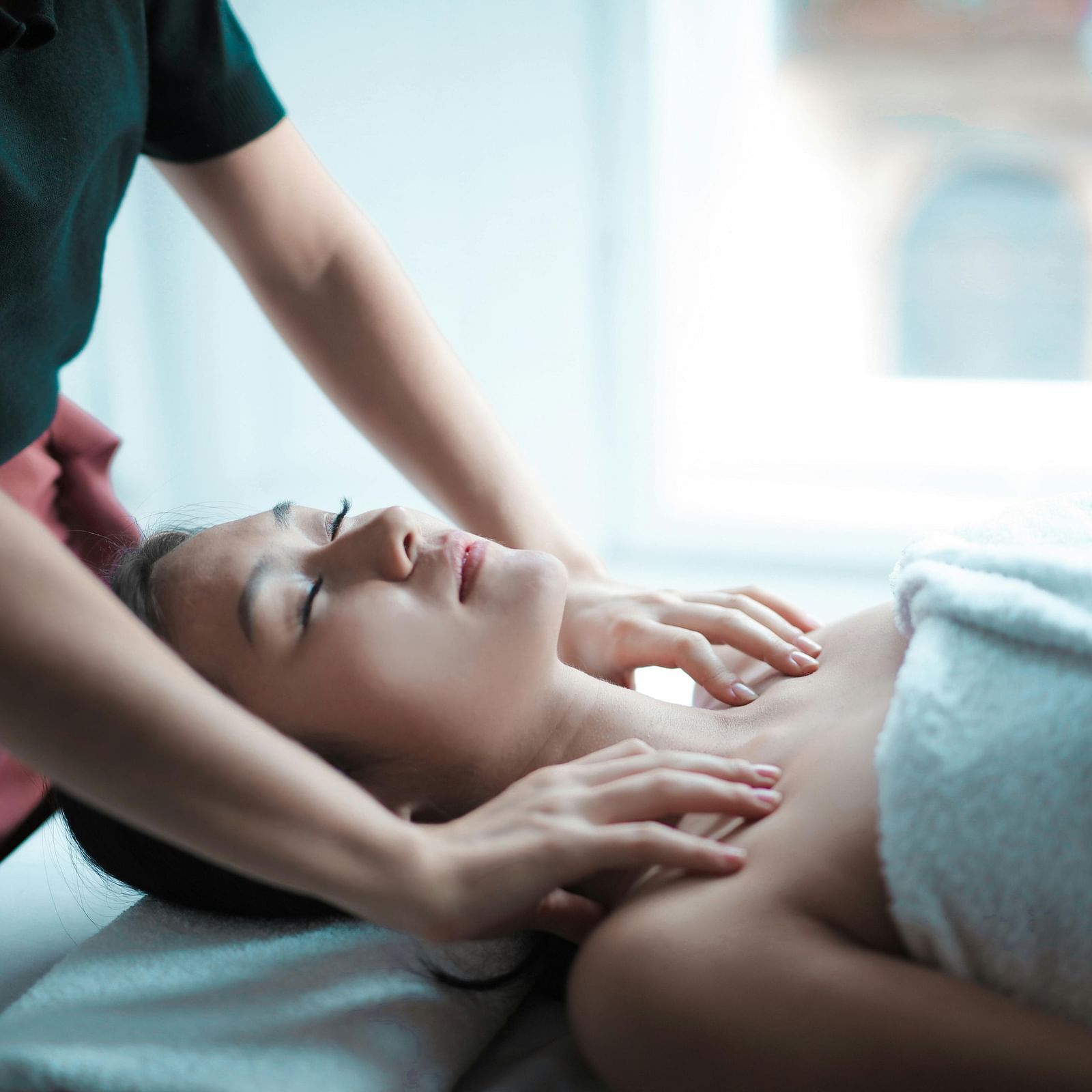 A woman getting a massage at the spa