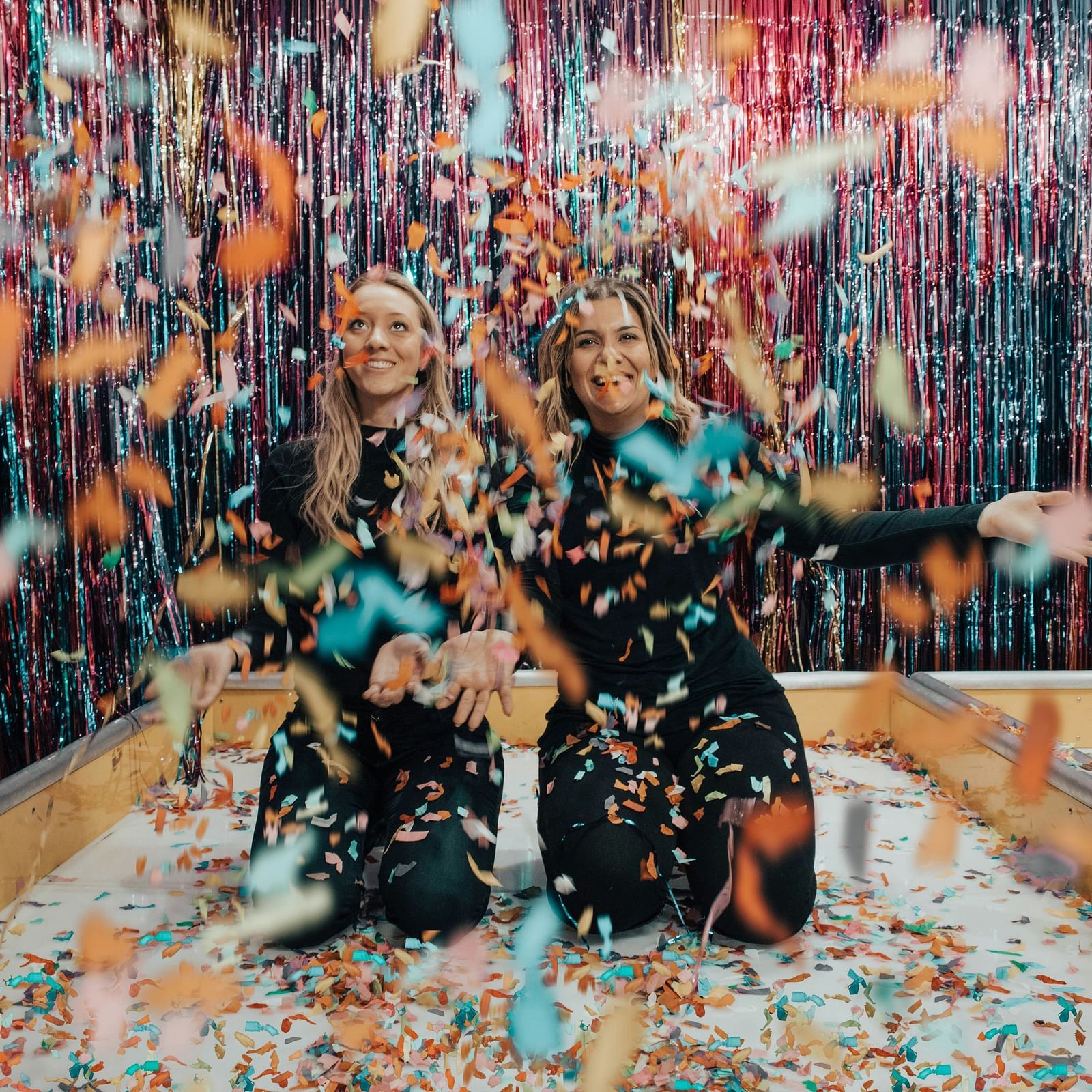 two girls playing and enjoying the party