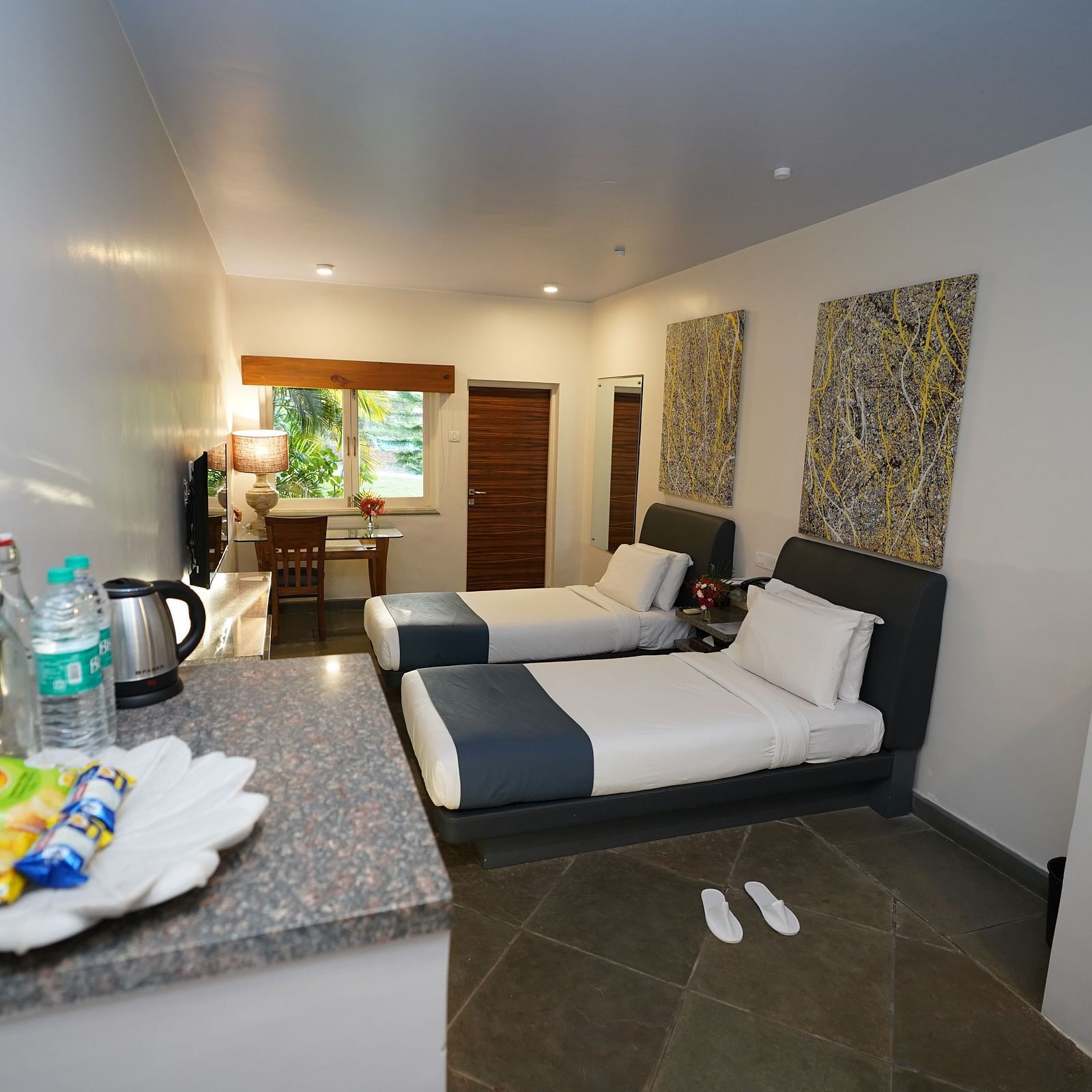 An image of a bedroom with twin beds and other room amenities - Argo By Trance, Goa