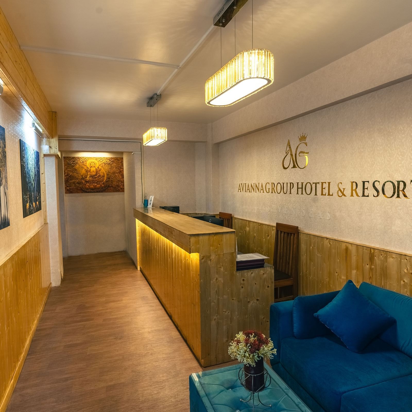 Reception area with warm welcoming lighting and wooden furnitures at Avianna Seven Seas, Darjeeling2