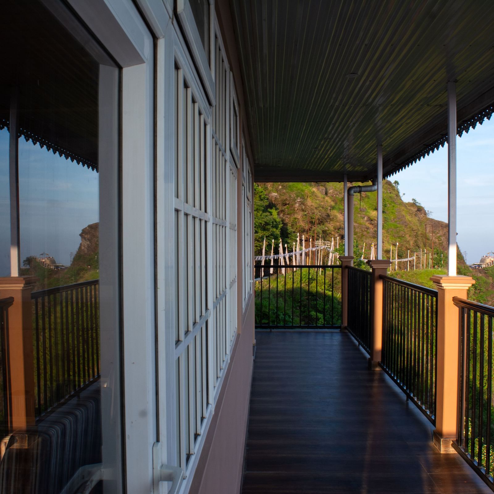 An image of a balcony with a backdrop of the Himalayas - Avianna Windy House Wellness Retreat & Spa