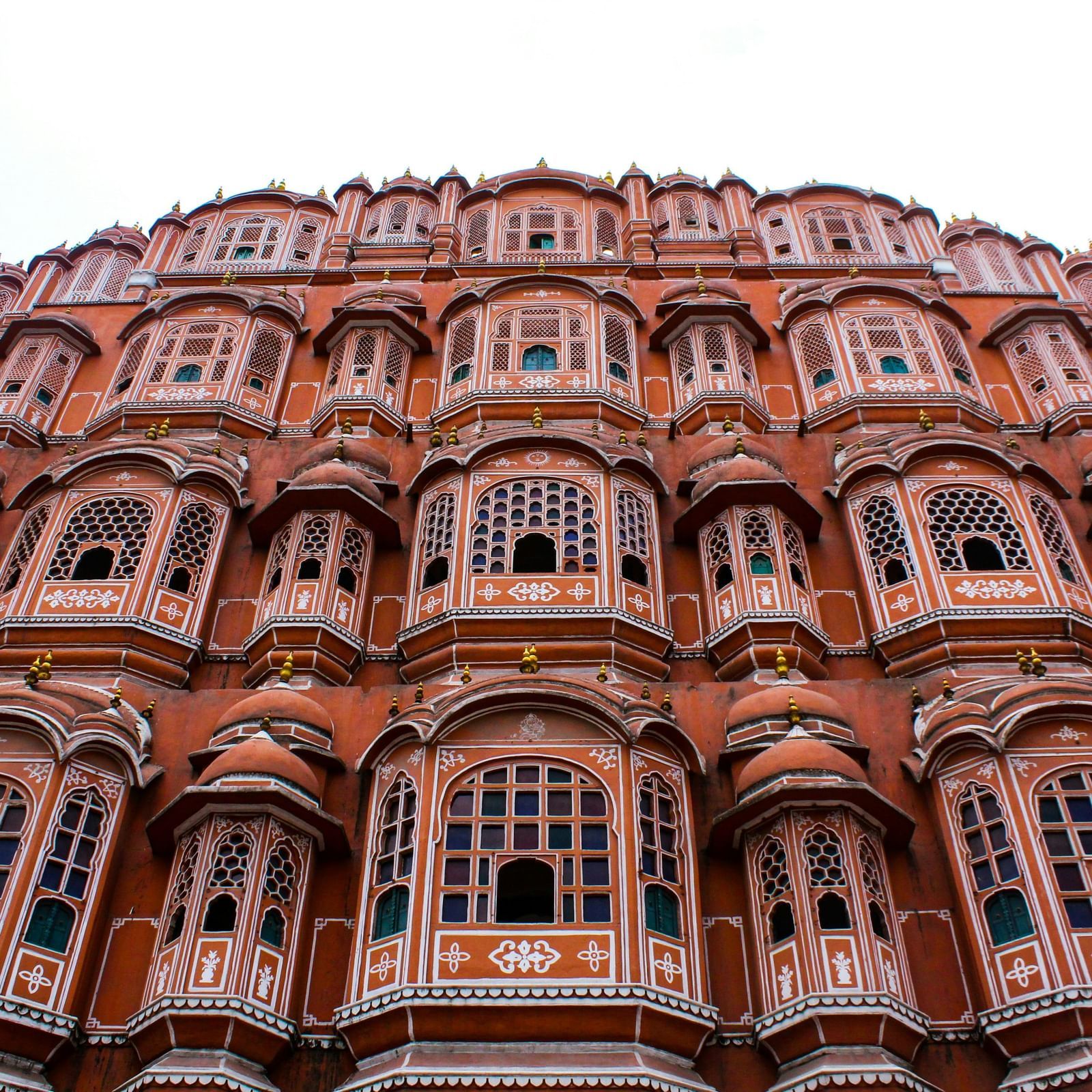 A multi-windowed palace against cloudy sky