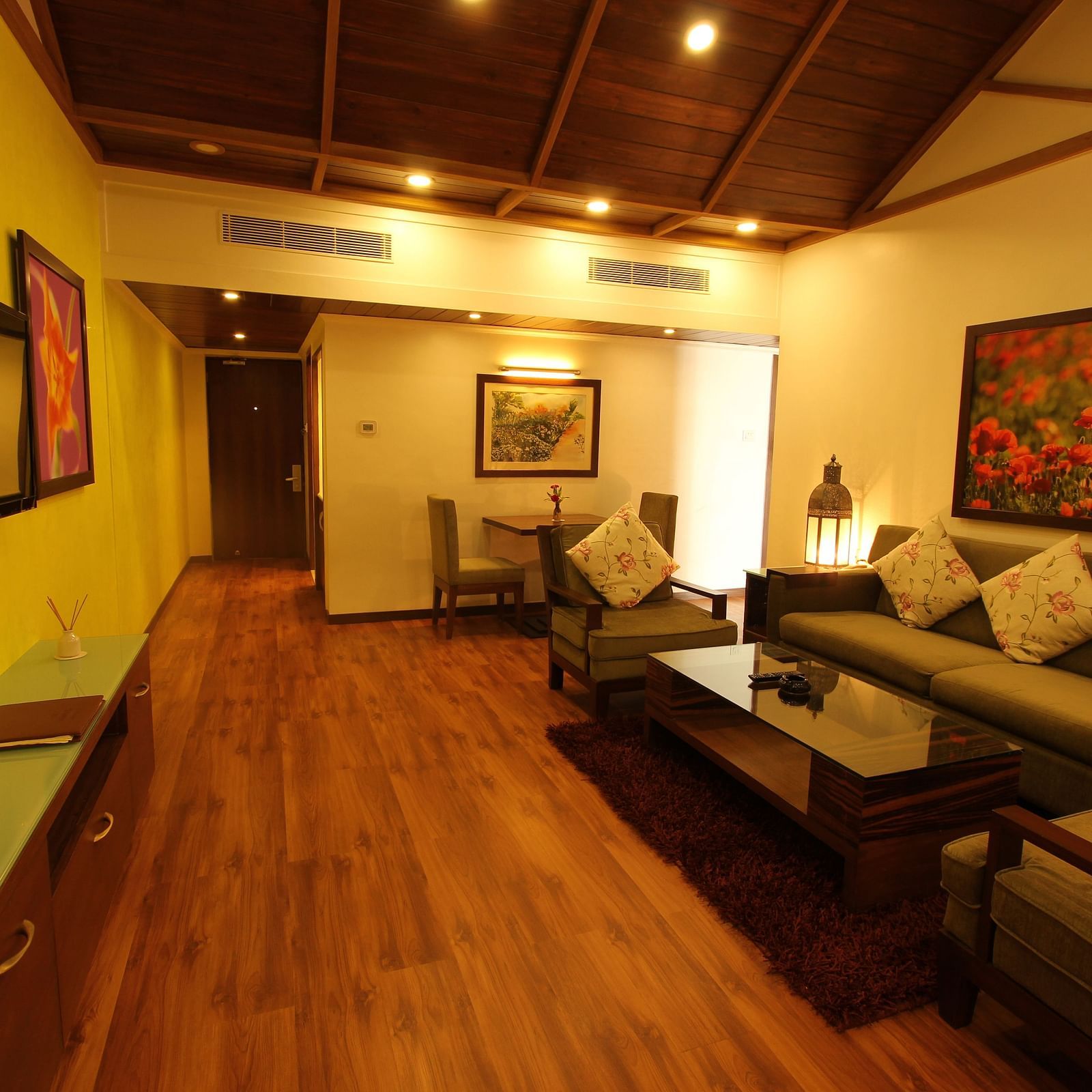 overview of the living room with sofas and a table inside Family villas - Caravela Beach Resort Goa