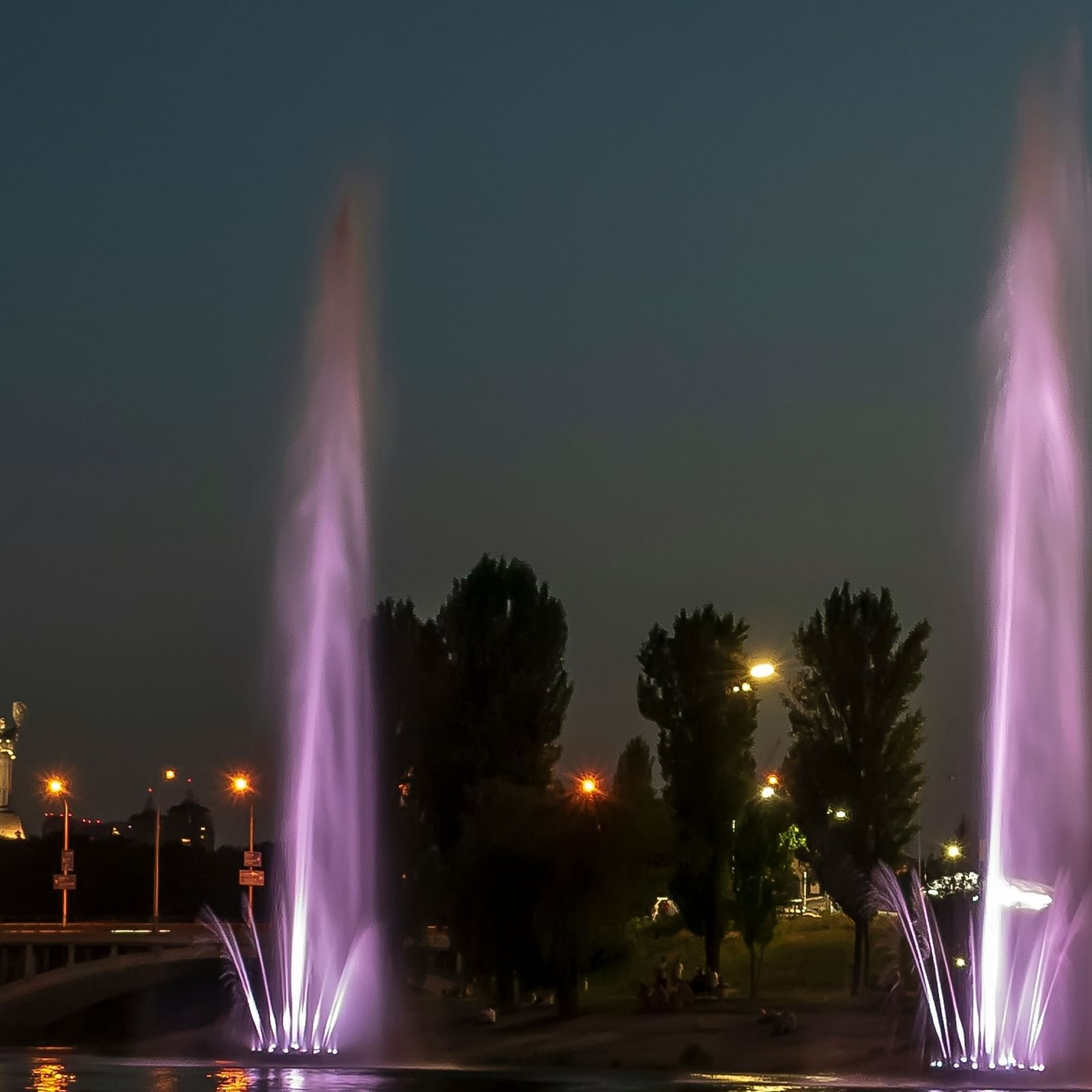 an image of fountains illuminating purple lights