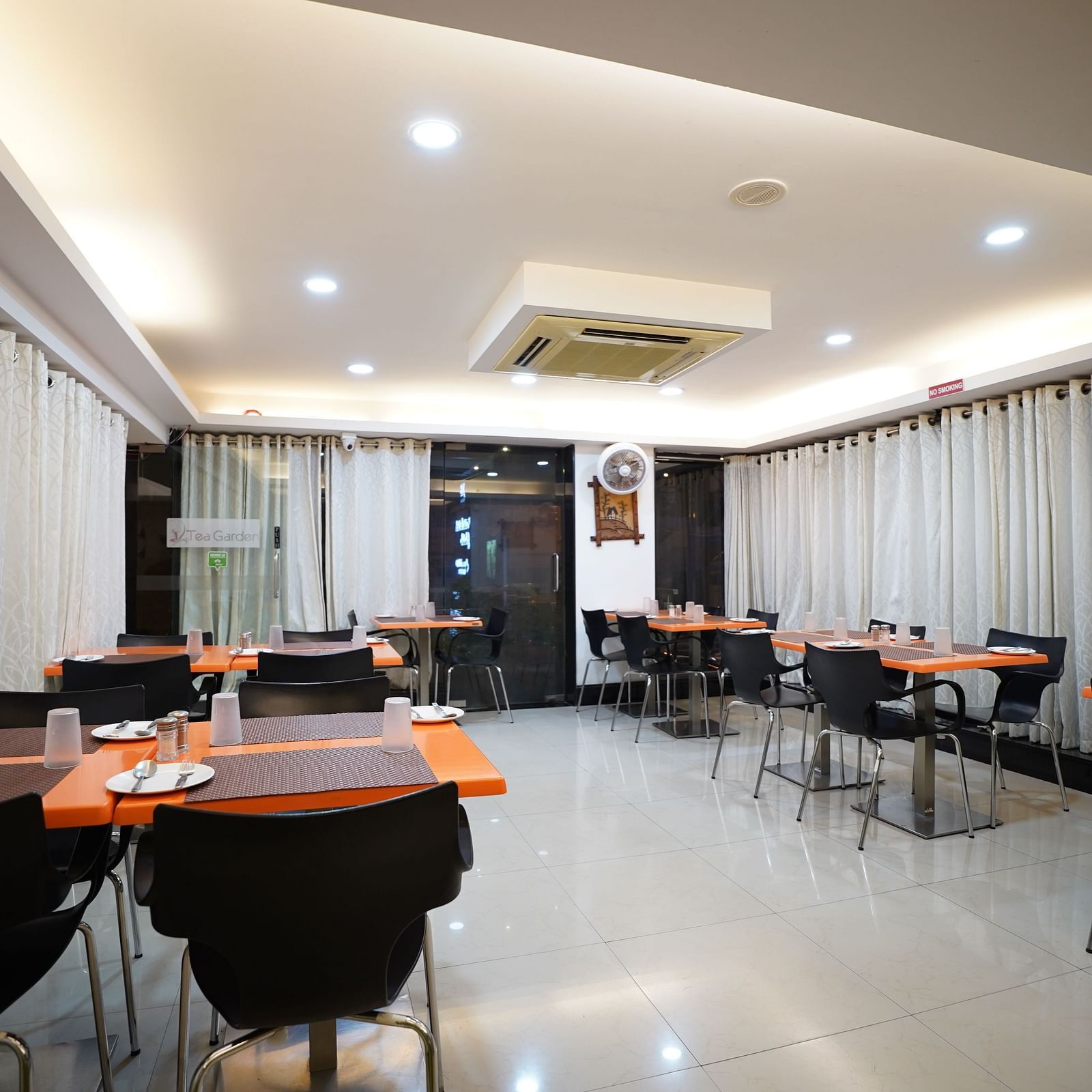 an image of a dining space with tables and chairs  at  City Centre Residency, Bangalore