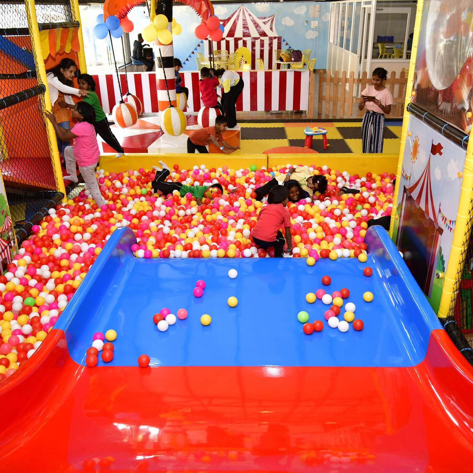 Children playing in a colorful ball pit at an indoor play area | Diamond Parks, Pune 