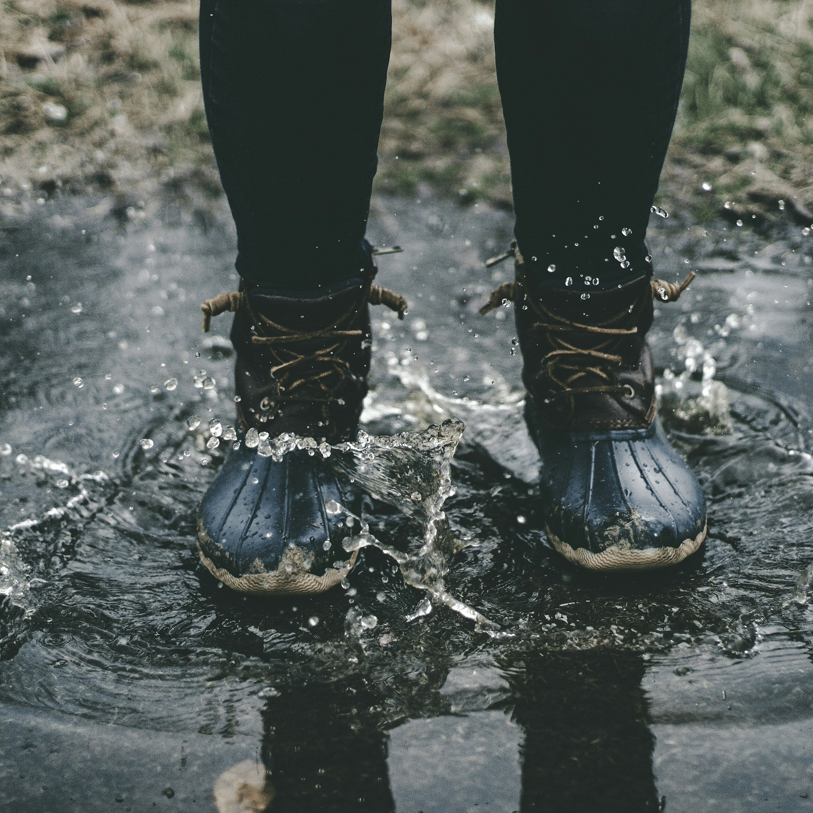 A shot of feet in a puddle