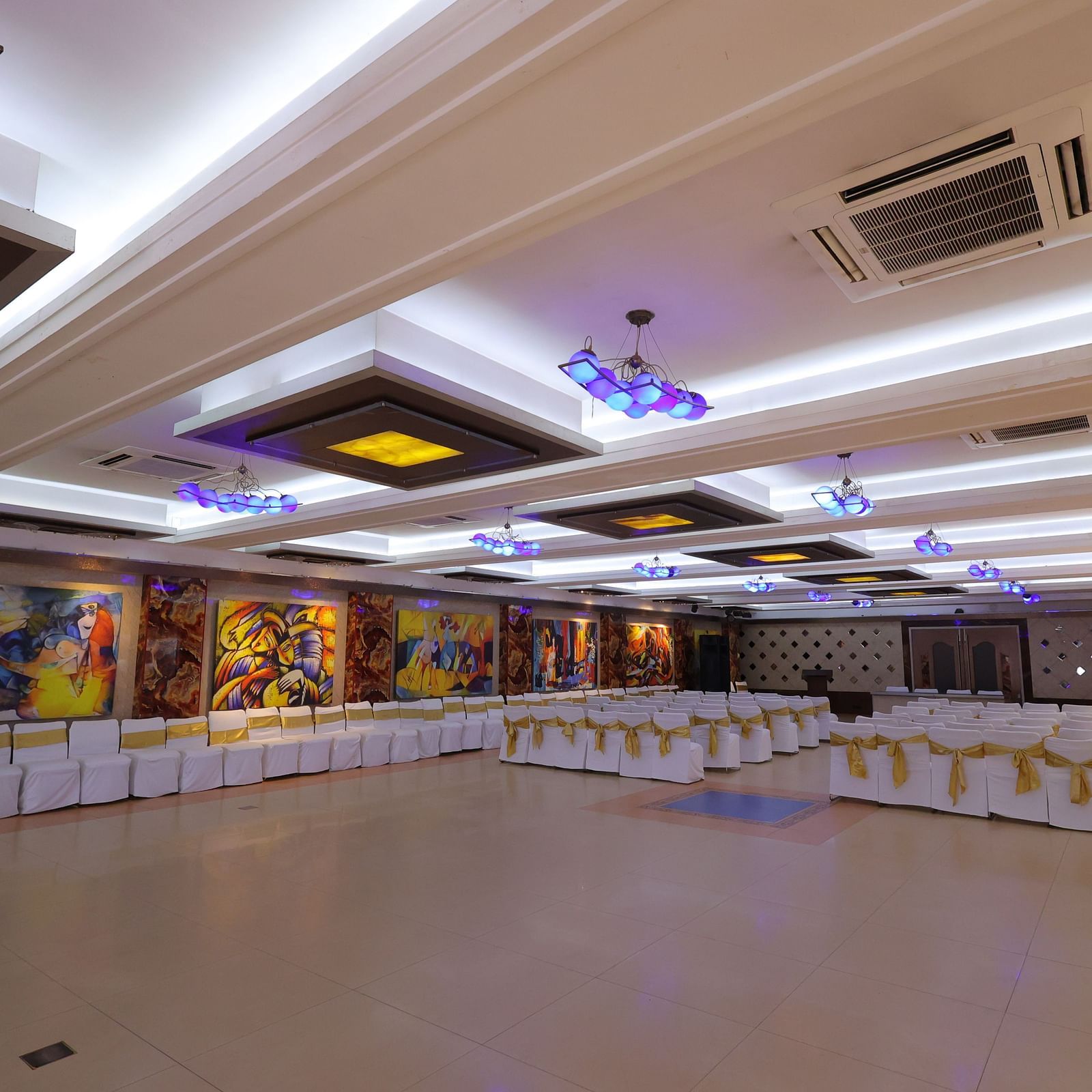 Image of Amar Convention Centre hall in Hotel Amar with theatre seating arrangement of chairs